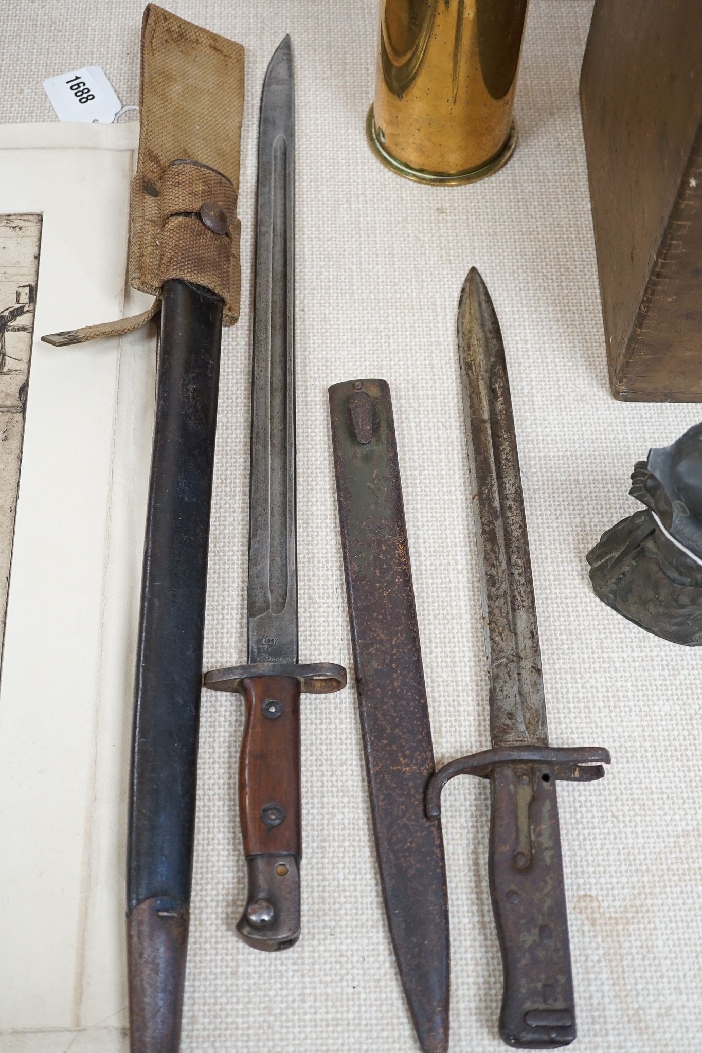 A British WWI Short & Mason compass, two bayonets, cartridge case, Lucas morse code, etc.